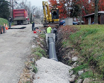 New sewer system being connected to existing drainage system.
