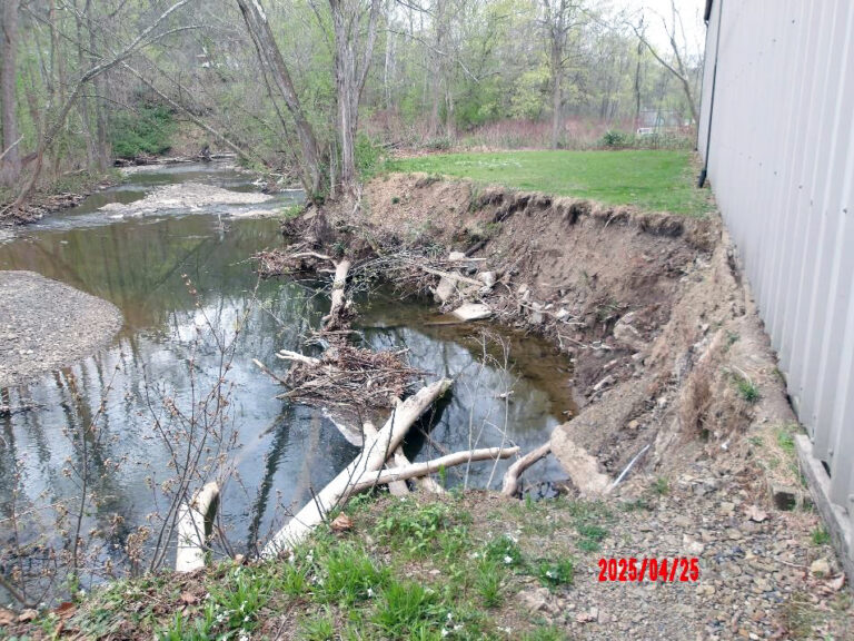 Severe streambank erosion threatens the Style-Rite Kitchen building